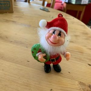 Vintage seven dwarfs Christmas ornament. Happy Santa.